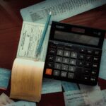 a calculator sitting on top of a wooden table